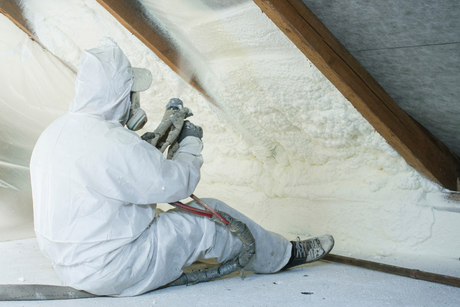 worker-blowing-in-insulation-in-attic